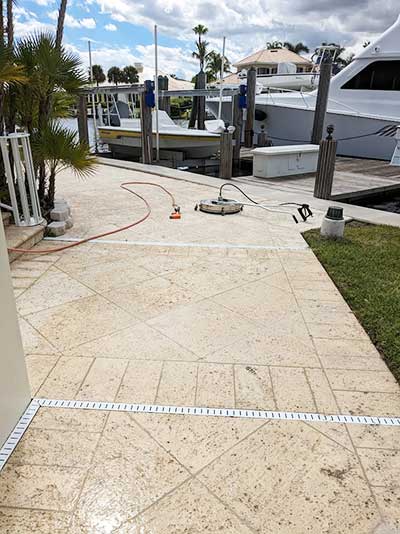 Images of driveway pressure cleaning in Indian River County