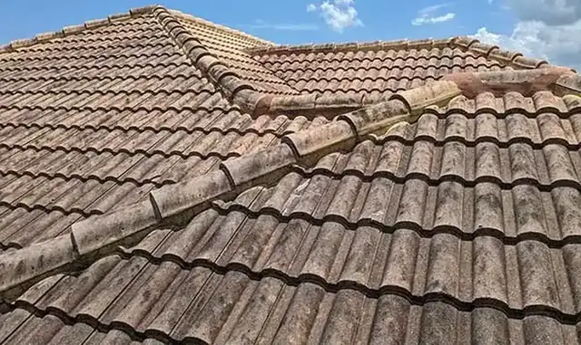 Soft wash roof cleaning on a tile roof in Vero Beach