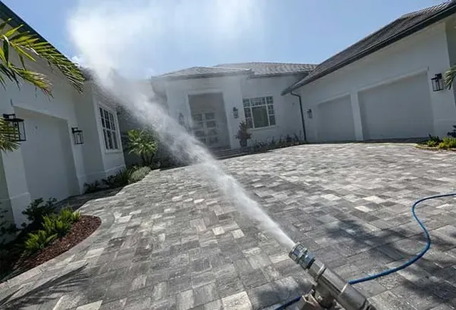 Exterior cleaning on a white home — safe, controlled methods